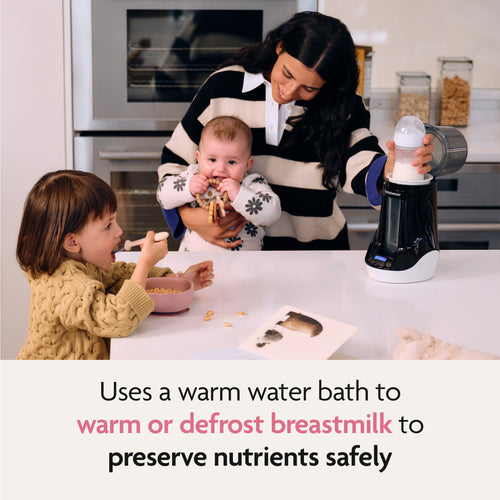 A woman uses the Baby Brezza UK Bottle & Breastmilk Warmer to gently warm a baby bottle as she holds her baby; nearby, a toddler enjoys cereal. Text below: Uses a warm water bath to safely preserve breastmilk nutrients while warming or defrosting. - product thumbnail