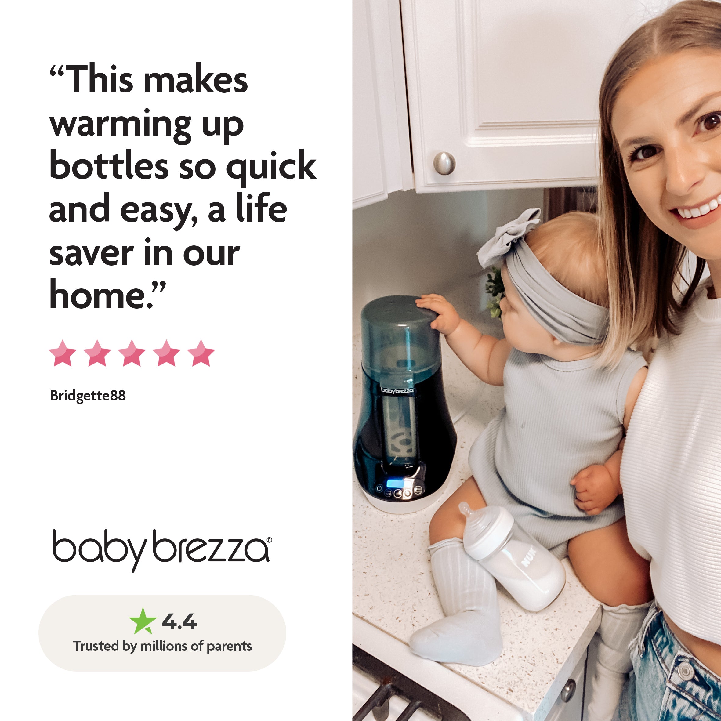 A smiling woman holds a baby in a kitchen by the Baby Brezza UK Baby Brezza BUNDLE Steriliser Dryer Advanced Black And Bottle & Breast Milk Warmer, with a parent testimonial and 4.4-star rating shown on the left. - product thumbnail