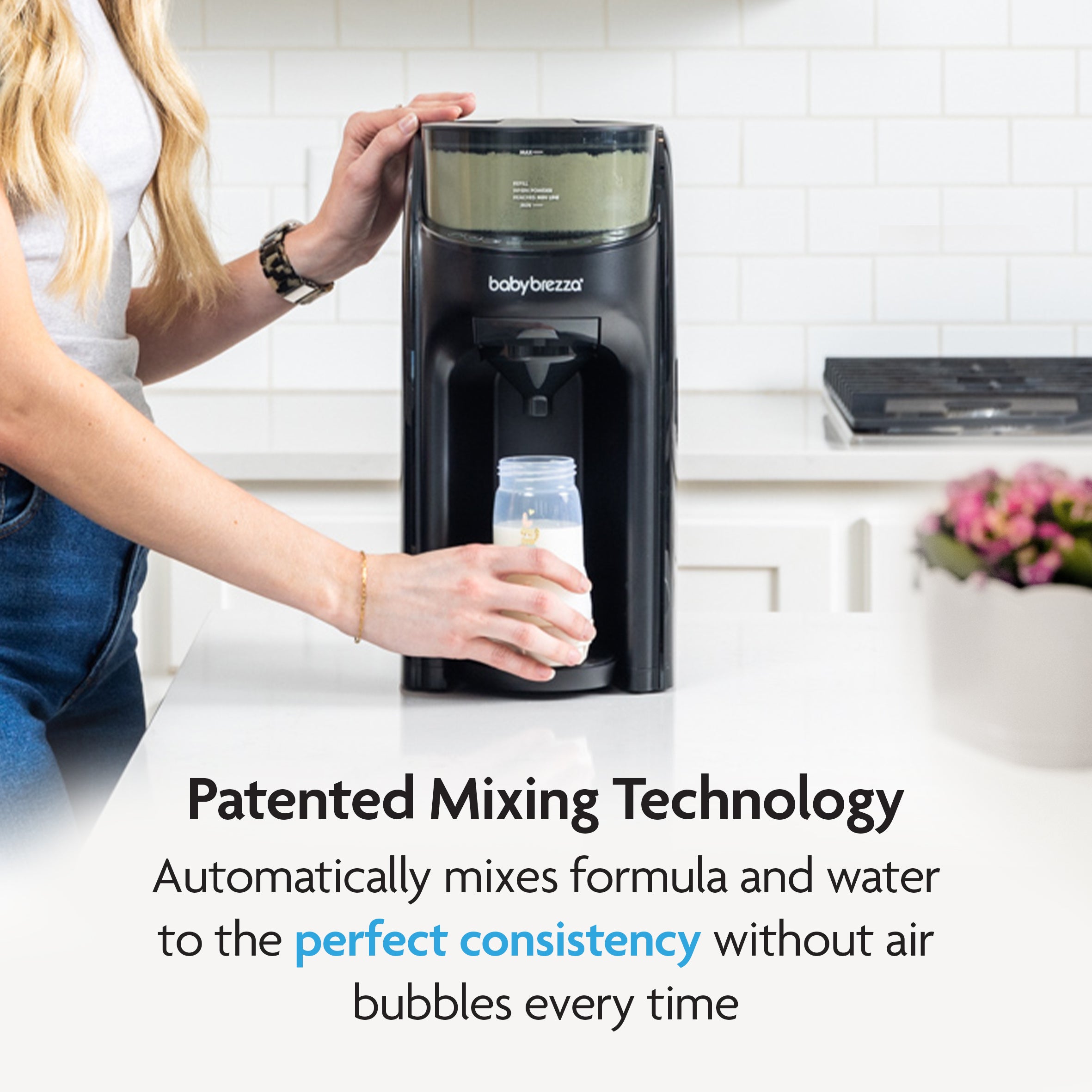 A woman uses the Baby Brezza UK BUNDLE: Formula Pro Advanced + Extra Funnel & Cover Set in a modern kitchen. Text reads: Patented Mixing Technology automatically blends formula and water to perfect consistency without air bubbles every time. - product thumbnail