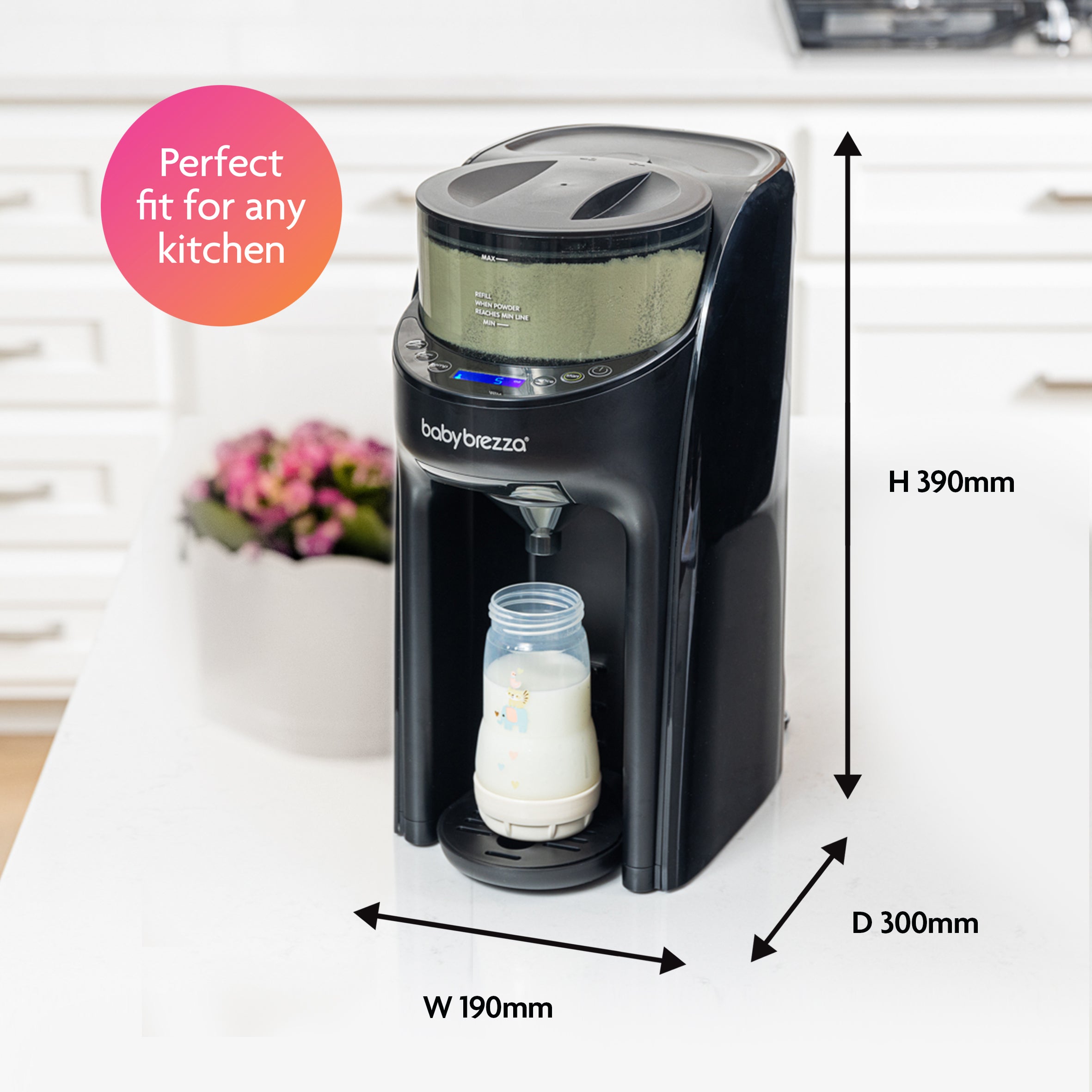 A black Baby Brezza UK BUNDLE: Formula Pro Advanced + Extra Funnel & Cover Set prepares formula in a baby bottle on a kitchen counter. Perfect fit for any kitchen—dimensions: height 390mm, depth 300mm, width 190mm. - product thumbnail