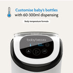 Close-up of the Baby Brezza UK BUNDLE Formula Pro Mini White with digital display set to 60ml. Text reads: Customise bottles from 60-300ml with body temperature formula, plus thermometer icon above. Includes SuperQuick Steriliser Black. - product thumbnail