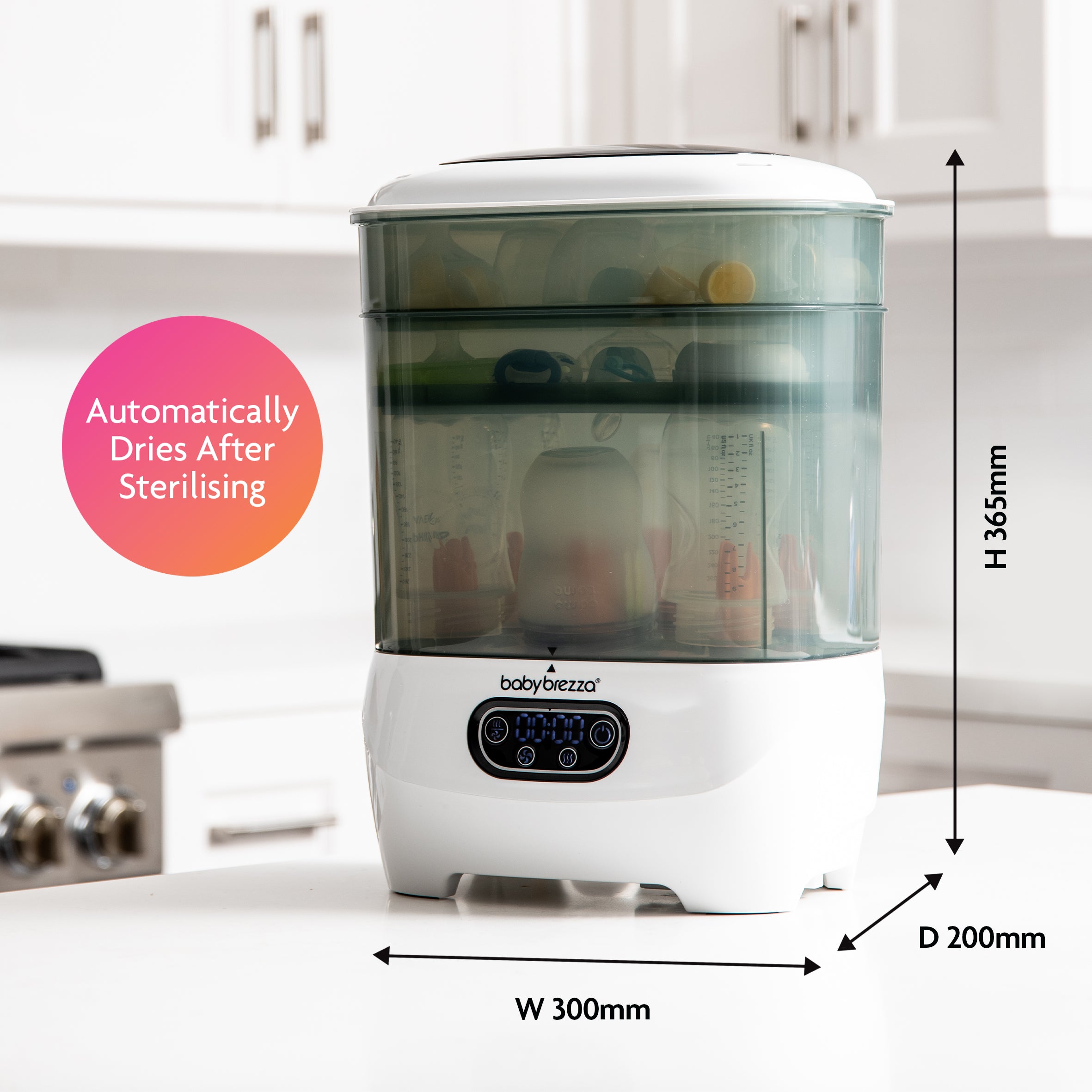 A white and gray Baby Brezza UK Steriliser Dryer Advanced sits on a kitchen counter with bottles inside. Text reads Automatically Dries After Sterilising. HEPA filter included. Dimensions: 300mm W x 200mm D x 365mm H. - product thumbnail