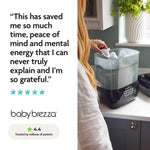 A woman loads bottles into the Baby Brezza UK BUNDLE Steriliser Dryer Advanced Black & Bottle & Breast Milk Warmer, a trusted favorite with glowing reviews, a five-star rating, and a 4.4-star score from millions of parents. - product thumbnail