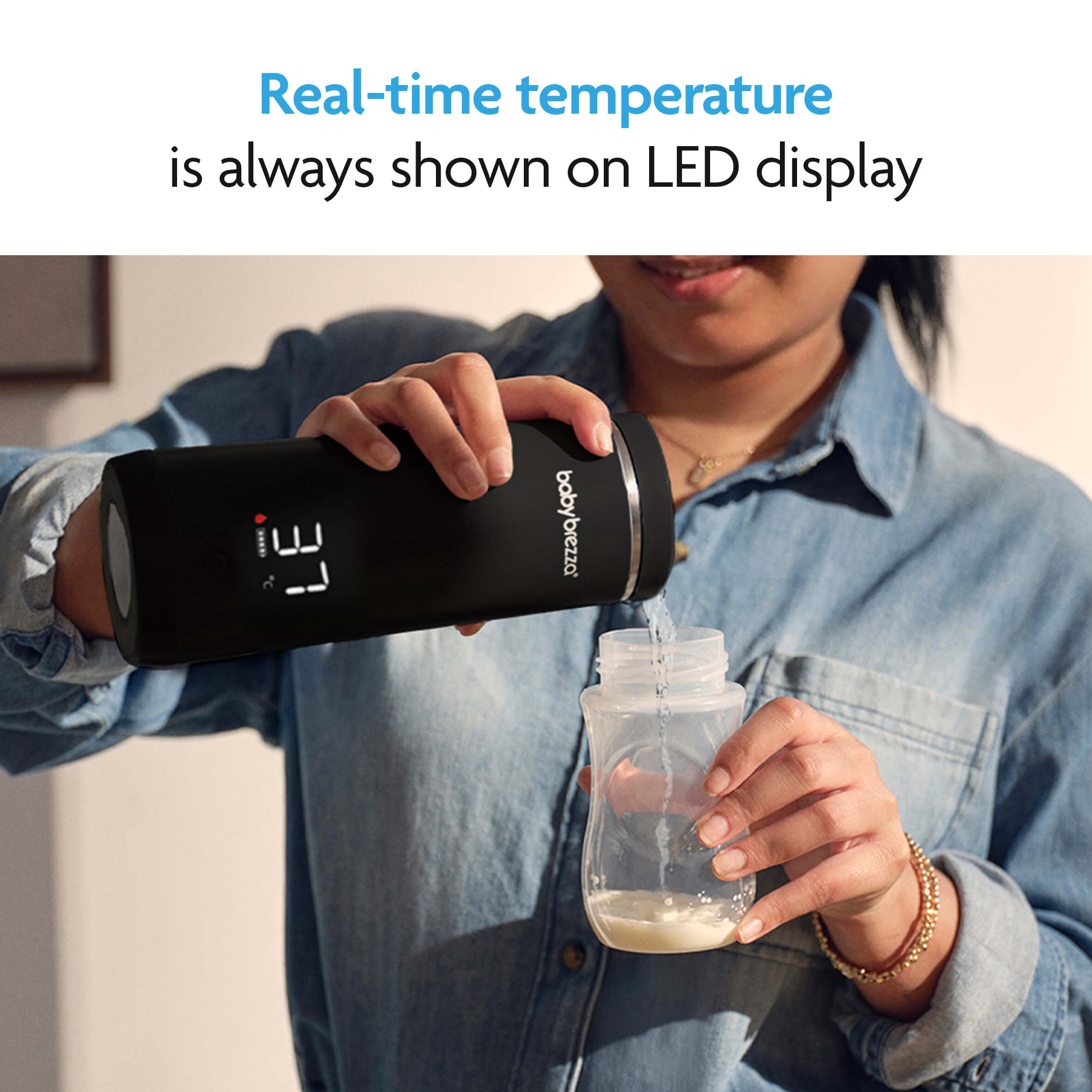 A person pours milk from the Baby Brezza UK ALWAYS READY BUNDLE—Formula Pro Mini + Superfast Portable Bottle Warmer with an LED display showing 37°C. Text: Real-time temperature on display; perfect for travel or on-the-go feeding. - product thumbnail