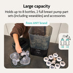 A person loads breast pump parts into the Baby Brezza BUNDLE Formula Pro Advanced And SuperQuick Steriliser - All Black, which holds up to 8 bottles, 2 full breast pump sets, and accessories from any brand. Ideal for use with your bottle maker. - product thumbnail