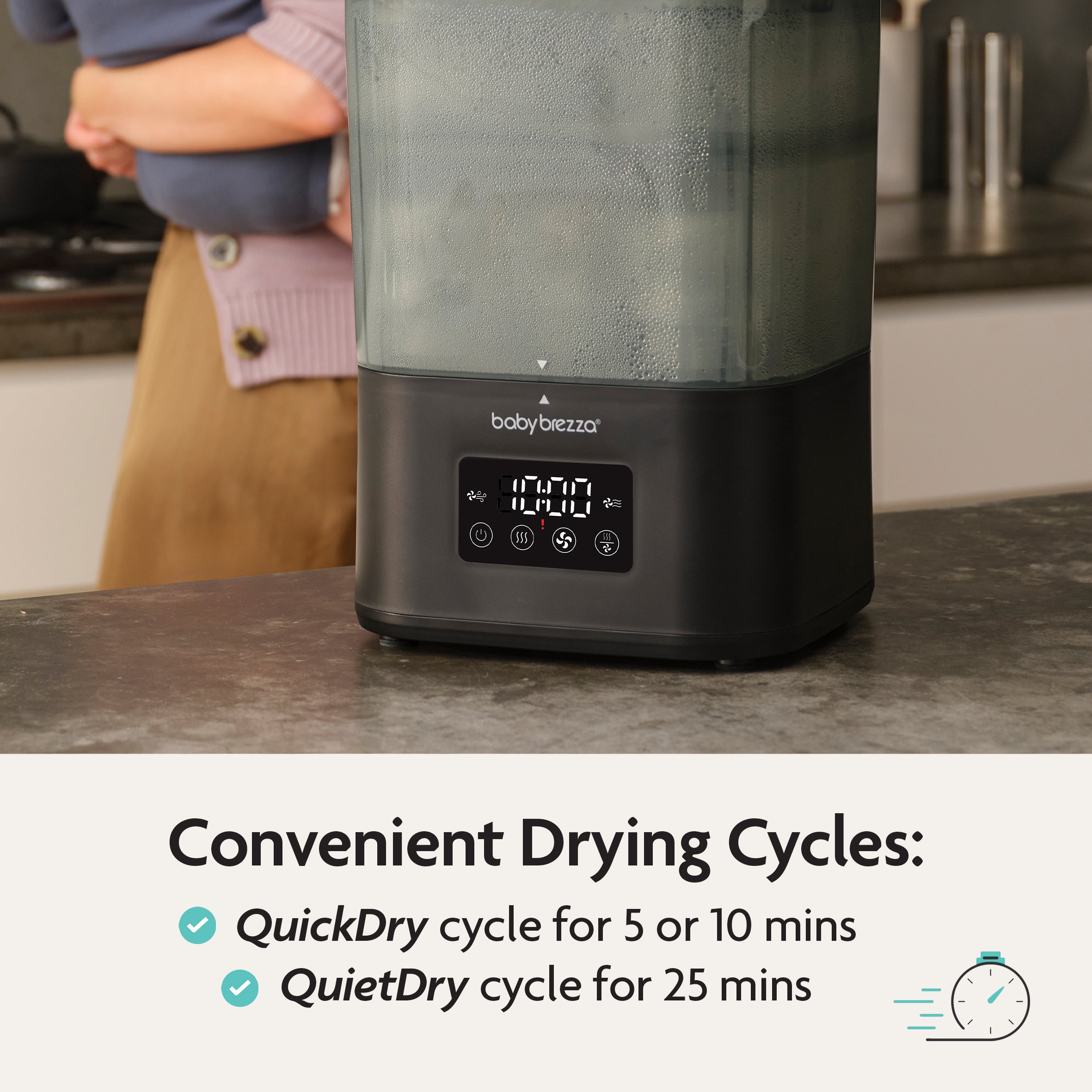 A person stands behind the Baby Brezza UK BUNDLE Formula Pro Mini White and SuperQuick Steriliser Black, drying baby bottles. The display shows drying settings: QuickDry (5/10 min) or QuietDry (25 min), with checkmarks and a clock icon. - product thumbnail