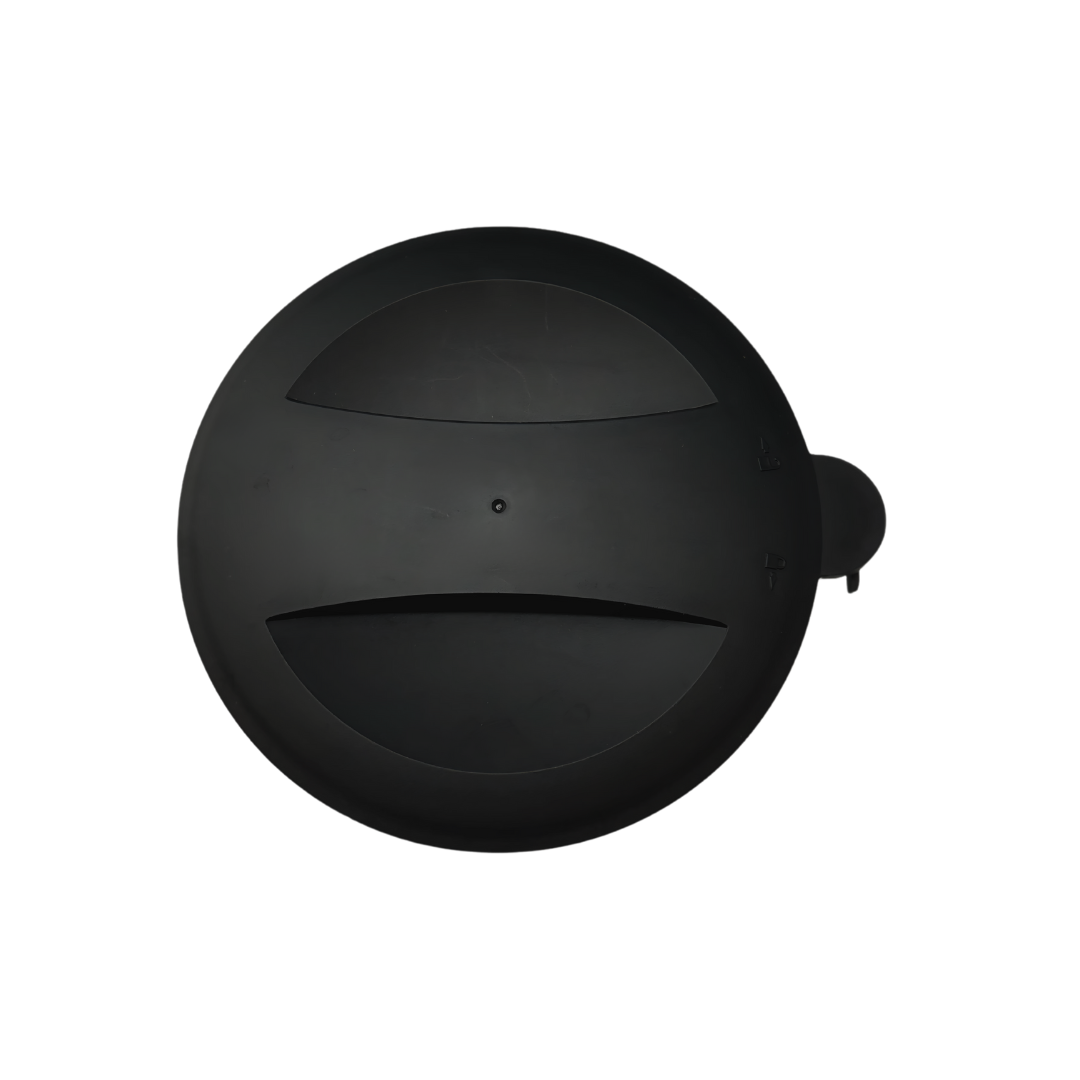 A top-down view of the Baby Brezza UK Formula Pro Advanced Black Replacement Powder Container Lid, showing its two curved slots and a small tab with plus/minus symbols, set against a white background. - product thumbnail