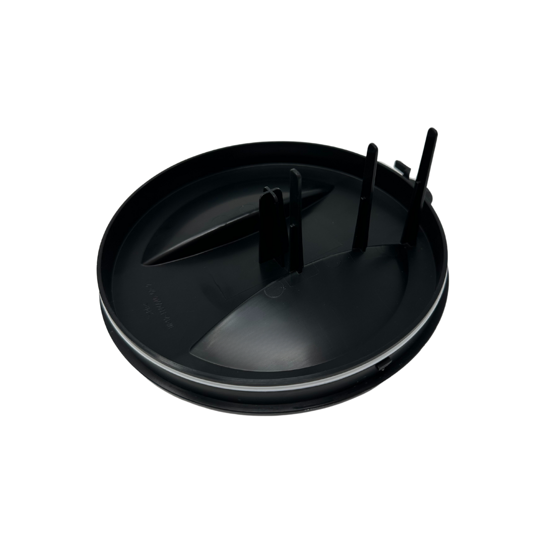 A round, black plastic Replacement Powder Container Lid by Baby Brezza UK for the Formula Pro Advanced, featuring two vertical prongs and a raised section, shown against a white background. - product thumbnail