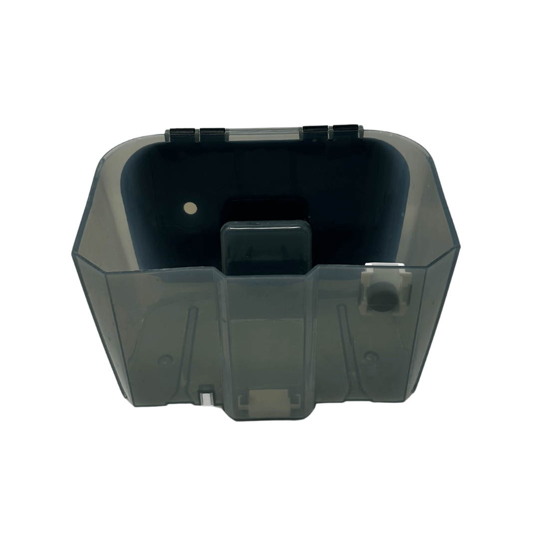 The Baby Brezza UK Bottle Washer Replacement Waste Water Tank is a translucent, rectangular plastic tank with a hinged lid and small circular latch, shown on a white background. - product thumbnail
