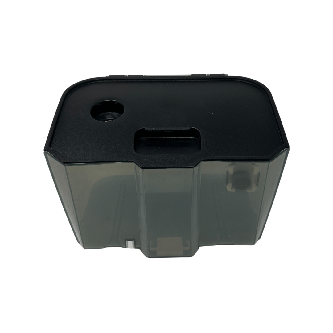 The Baby Brezza UK Bottle Washer Replacement Waste Water Tank is a black and translucent rectangular plastic container with a hole and slot on top, designed for Bottle Washer Pro systems, shown from above against a white background. - product thumbnail