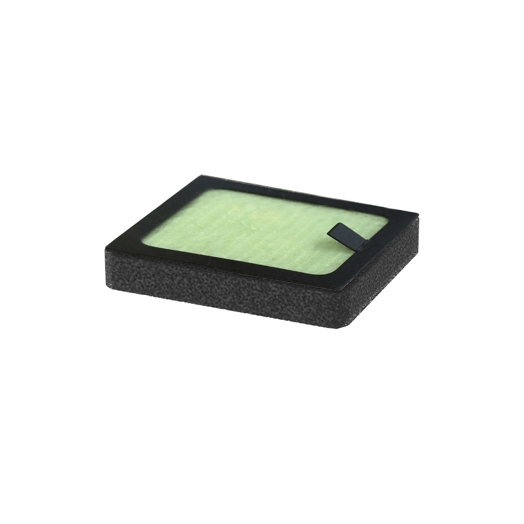 The Baby Brezza UK Replacement Hepa Filter for the Bottle Washer Pro features a rectangular black frame with a pull tab, shown on a white background—perfect for maintaining germ-free air. - product thumbnail